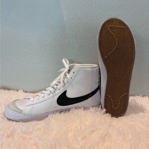 Nike White High-Top Sneakers with Black Swoosh
